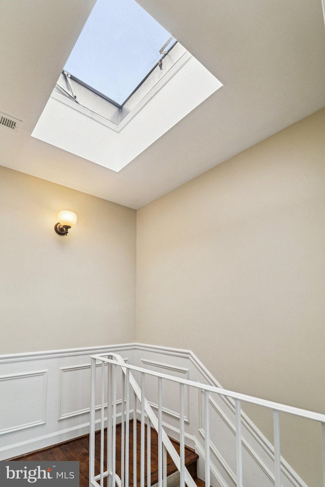 1803 T St NW Unit 11, Washington, DC 20009 - stairs with a skylight, wainscoting, and wood finished floors