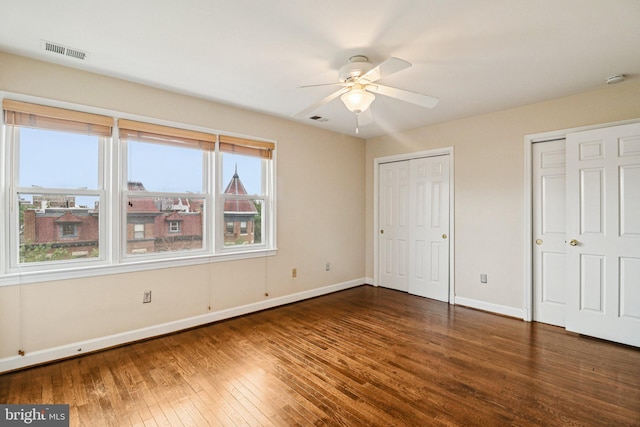 1803 T St NW Unit 11, Washington, DC 20009 - unfurnished bedroom with hardwood / wood-style flooring, multiple closets, and ceiling fan