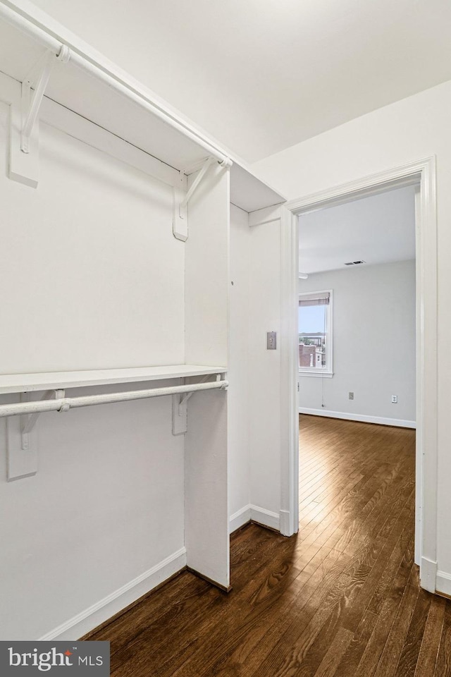 1803 T St NW Unit 11, Washington, DC 20009 - walk in closet with dark wood-style floors
