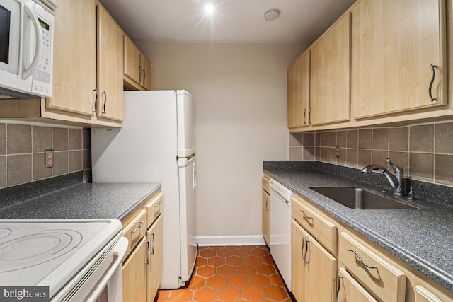 1803 T St NW Unit 11, Washington, DC 20009 - kitchen with white appliances, dark tile patterned floors, backsplash, and light brown cabinetry