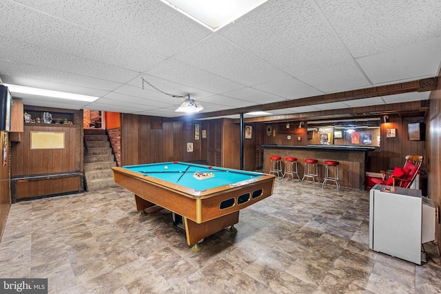 5139 Celestial Way, Columbia, MD 21044 - playroom with wood walls, a bar, a paneled ceiling, billiards, and stone finish flooring