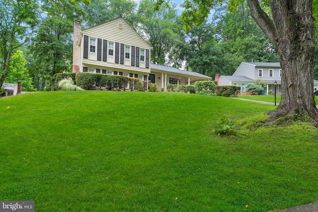 5139 Celestial Way, Columbia, MD 21044 - tri-level home featuring a chimney and a front yard