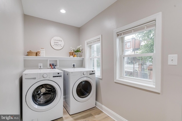 3910 E Pratt St, Baltimore, MD 21224 - washroom featuring washer and dryer and light wood finished floors