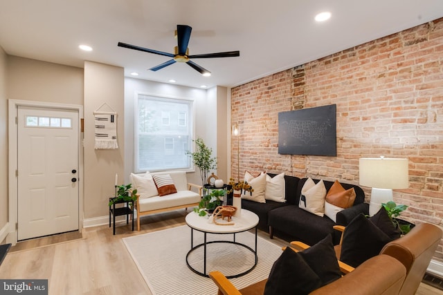 3910 E Pratt St, Baltimore, MD 21224 - living room with brick wall, plenty of natural light, a ceiling fan, wood finished floors, and recessed lighting