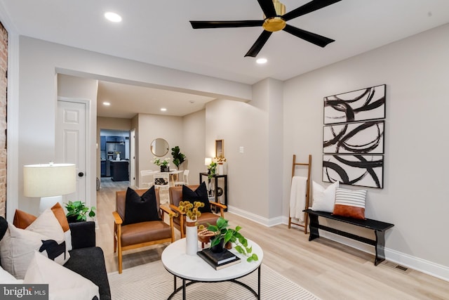 3910 E Pratt St, Baltimore, MD 21224 - living room featuring light wood-style floors, ceiling fan, and recessed lighting