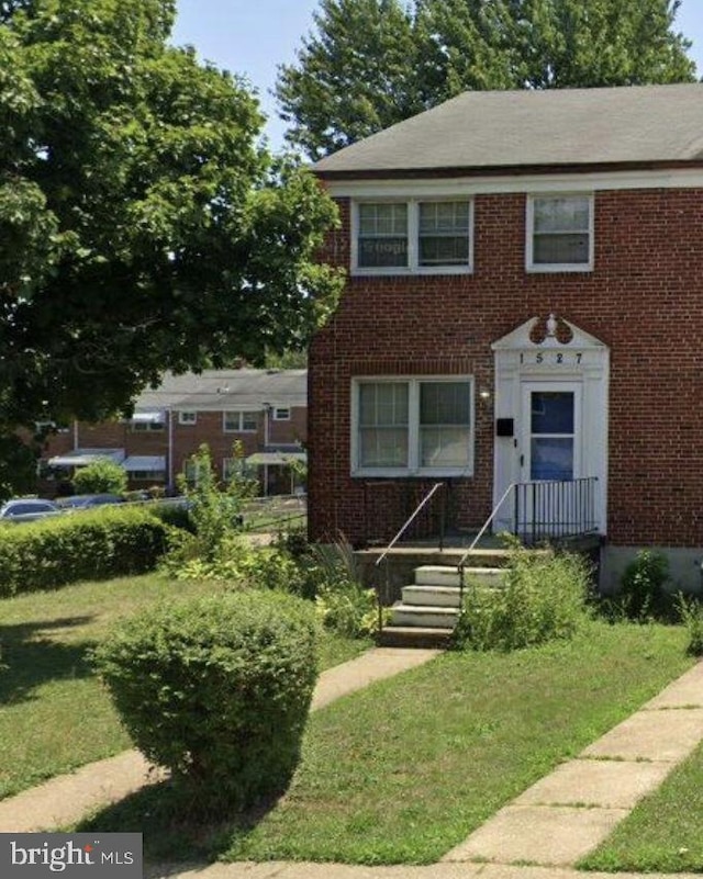 1527 Ingleside Ave, Baltimore, MD 21207 - view of front facade featuring brick siding and a front lawn