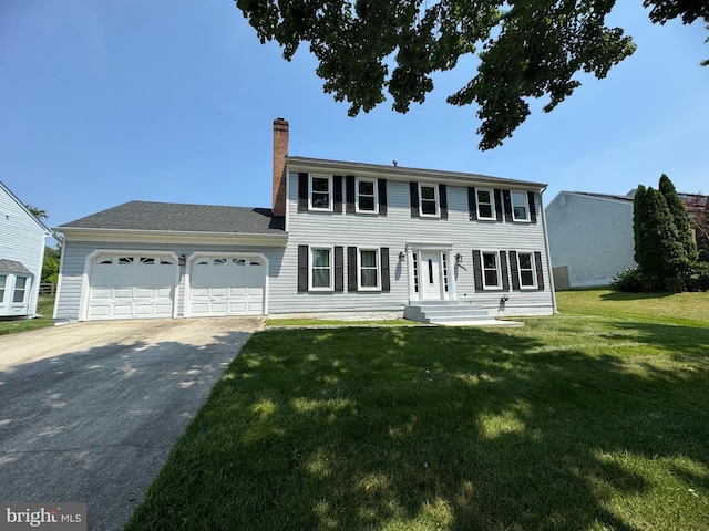 2101 Waterleaf Way, Bowie, MD 20721 - colonial inspired home featuring a garage, driveway, a chimney, and a front yard