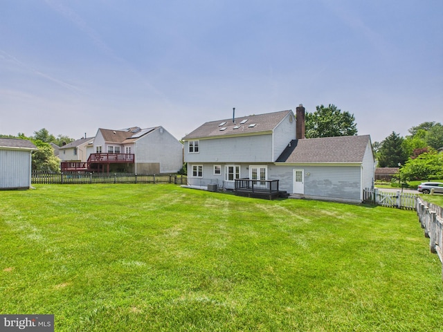 2101 Waterleaf Way, Bowie, MD 20721 - back of property with a deck, a fenced backyard, and a chimney