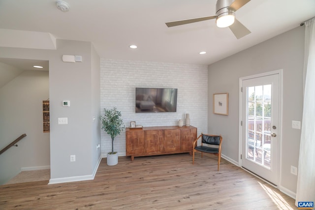 421 Willowshire Ct, Waynesboro, VA 22980 - sitting room with light wood finished floors, ceiling fan, recessed lighting, vaulted ceiling, and brick wall