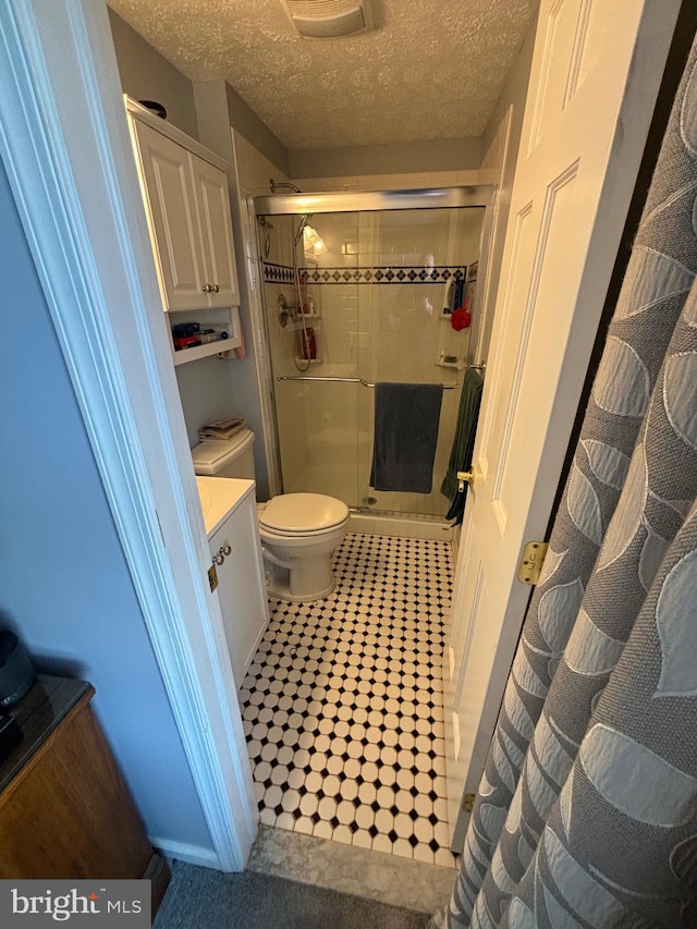 27 Dunlin Way, Sicklerville, NJ 08081 - bathroom with a stall shower, a textured ceiling, vanity, and tile patterned flooring