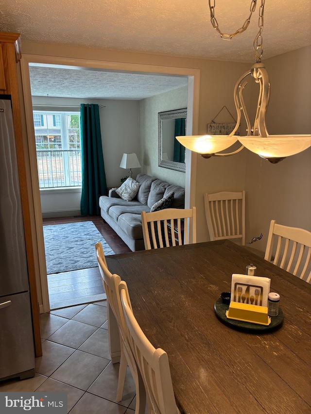 27 Dunlin Way, Sicklerville, NJ 08081 - dining space featuring a textured ceiling and tile patterned floors