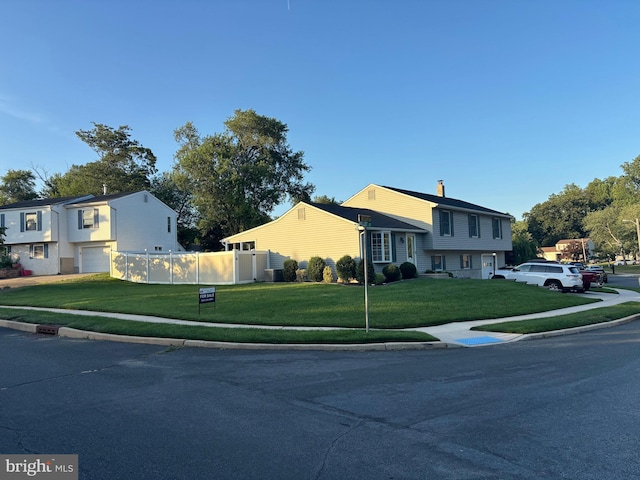 27 Dunlin Way, Sicklerville, NJ 08081 - split level home featuring an attached garage and a chimney