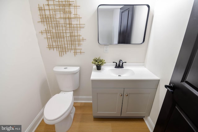 1117 Overbrook Rd, Baltimore, MD 21239 - half bathroom with vanity and wood finished floors