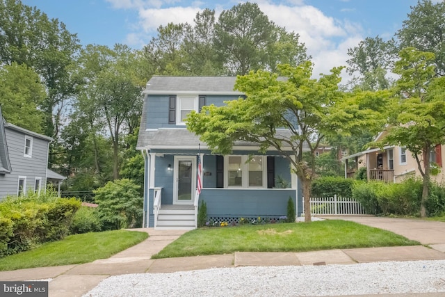 1117 Overbrook Rd, Baltimore, MD 21239 - view of front of home with covered porch and a shingled roof