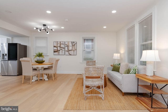 1117 Overbrook Rd, Baltimore, MD 21239 - living area with light wood finished floors, recessed lighting, and a chandelier