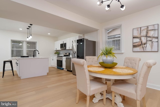 1117 Overbrook Rd, Baltimore, MD 21239 - dining area featuring light wood finished floors and recessed lighting