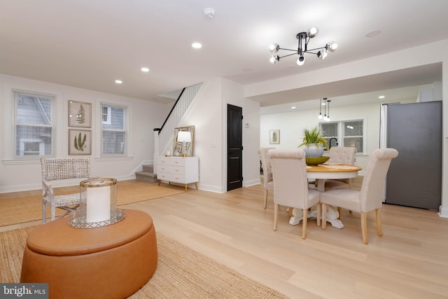 1117 Overbrook Rd, Baltimore, MD 21239 - dining space with stairway, light wood-type flooring, recessed lighting, and a chandelier