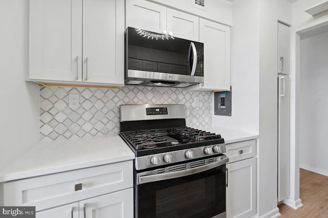 600 Roosevelt Blvd Unit 316, Falls Church, VA 22044 - kitchen featuring stainless steel appliances, light countertops, white cabinets, and backsplash