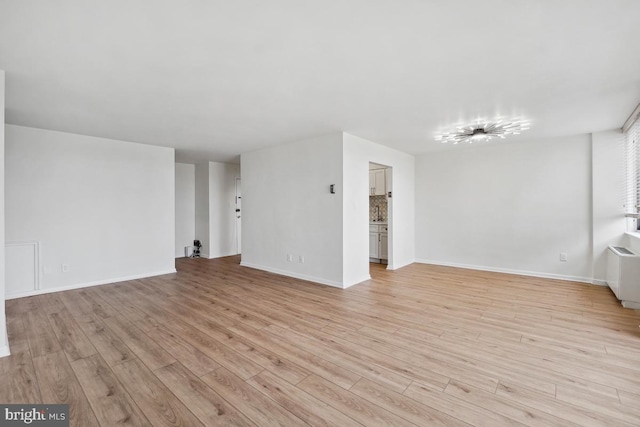 600 Roosevelt Blvd Unit 316, Falls Church, VA 22044 - unfurnished living room featuring light wood finished floors and baseboards