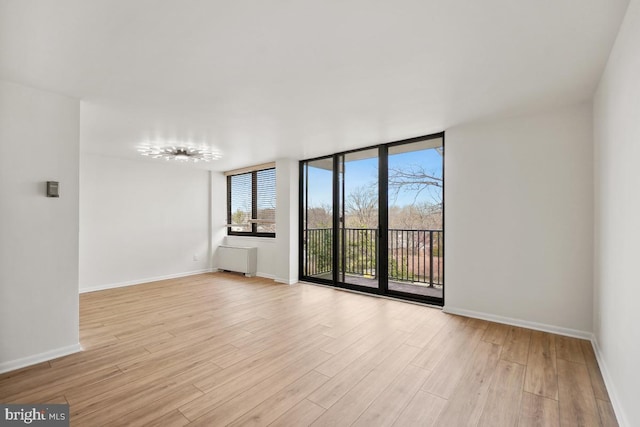 600 Roosevelt Blvd Unit 316, Falls Church, VA 22044 - empty room with light wood-style floors and radiator