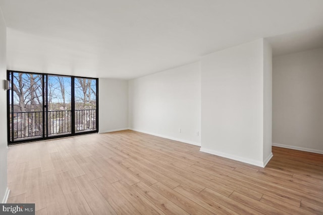 600 Roosevelt Blvd Unit 316, Falls Church, VA 22044 - unfurnished room featuring wood finished floors and floor to ceiling windows