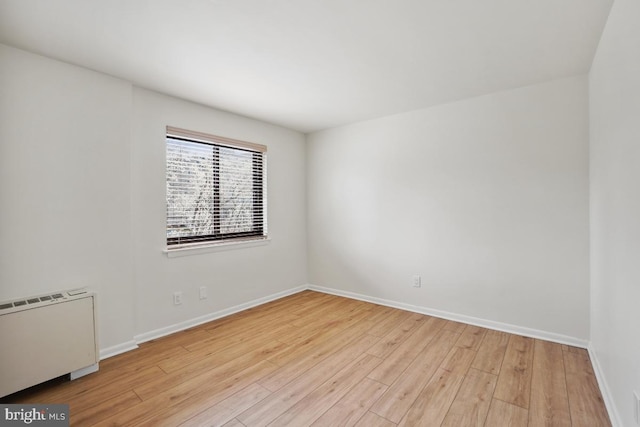 600 Roosevelt Blvd Unit 316, Falls Church, VA 22044 - spare room featuring wood finished floors and radiator