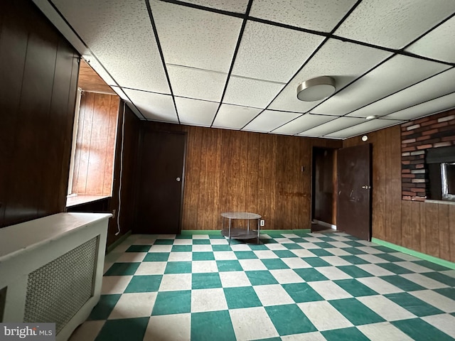 1825 S 8th St, Philadelphia, PA 19148 - unfurnished room with wood walls, light flooring, and a paneled ceiling