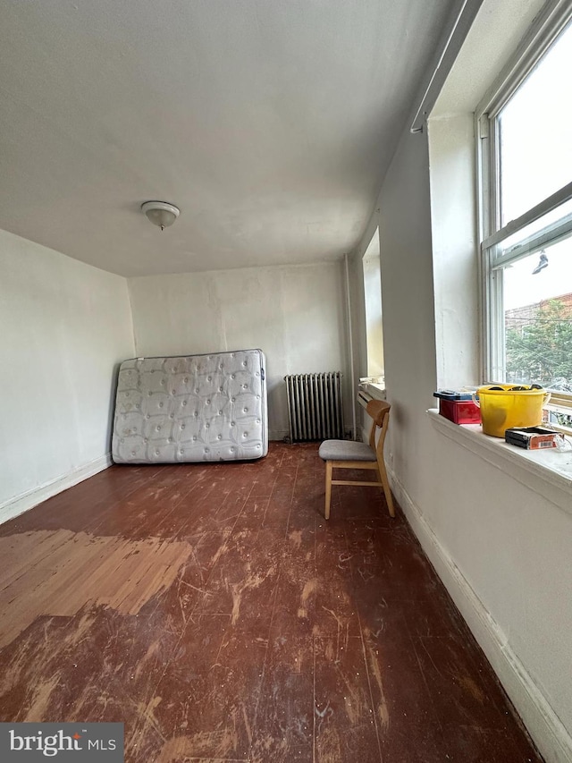 1825 S 8th St, Philadelphia, PA 19148 - additional living space featuring radiator heating unit and wood finished floors