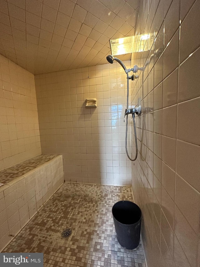 1825 S 8th St, Philadelphia, PA 19148 - bathroom with tile patterned flooring, a tile shower, and tile walls