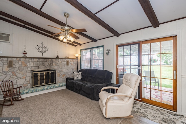 3735 Donegal Ln, Brookhaven, PA 19015 - living area with a ceiling fan, a stone fireplace, a wall unit AC, and wooden walls