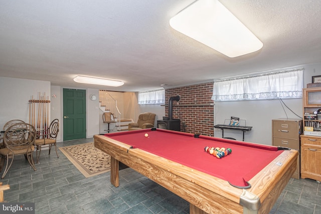 3735 Donegal Ln, Brookhaven, PA 19015 - game room featuring a wood stove, a textured ceiling, and billiards table