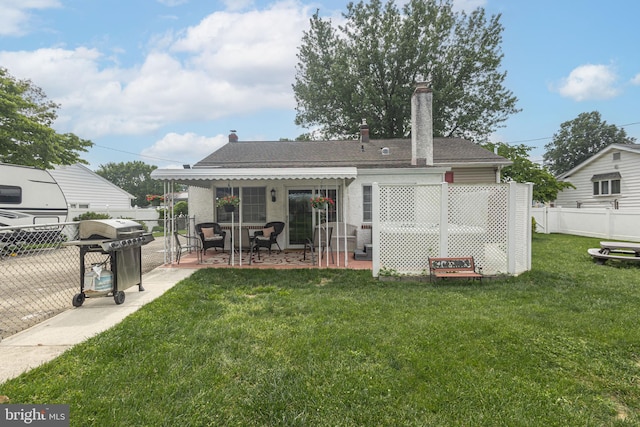 3735 Donegal Ln, Brookhaven, PA 19015 - back of house featuring a patio area and a chimney