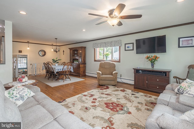 3735 Donegal Ln, Brookhaven, PA 19015 - living area with baseboard heating, wood finished floors, ornamental molding, a ceiling fan, and recessed lighting