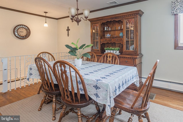 3735 Donegal Ln, Brookhaven, PA 19015 - dining room featuring wood finished floors and crown molding