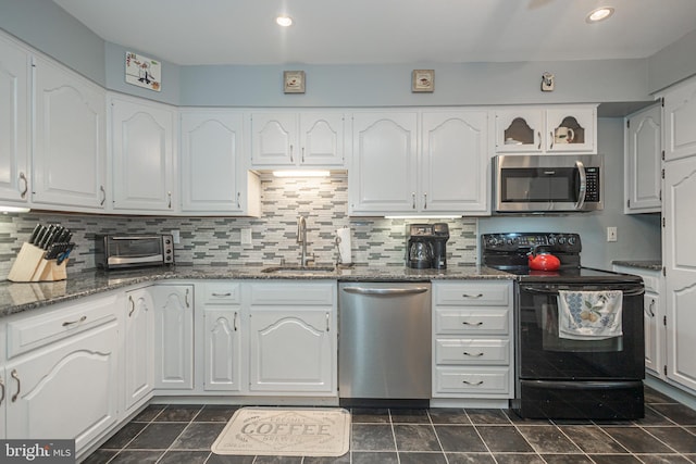 3735 Donegal Ln, Brookhaven, PA 19015 - kitchen with stainless steel appliances, white cabinetry, dark stone countertops, decorative backsplash, and recessed lighting