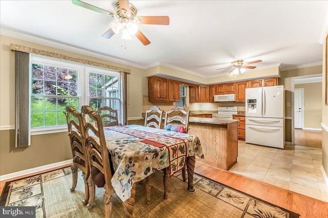 228 Benjamin Blvd, Bear, DE 19701 - dining room featuring ceiling fan, ornamental molding, and light wood-style flooring
