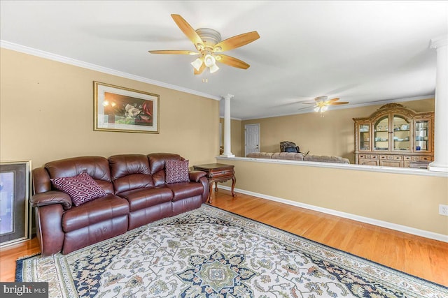 228 Benjamin Blvd, Bear, DE 19701 - living area featuring decorative columns, a ceiling fan, wood finished floors, and ornamental molding