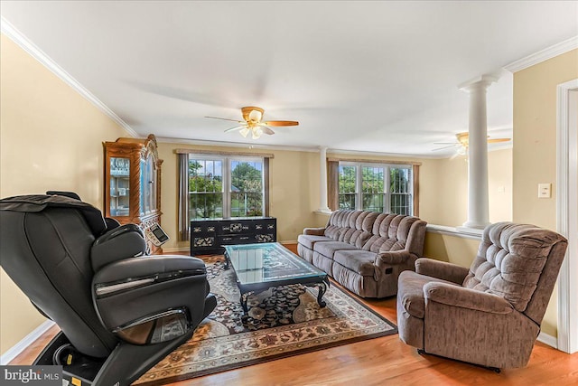 228 Benjamin Blvd, Bear, DE 19701 - living room featuring decorative columns, ceiling fan, ornamental molding, and light wood-style flooring