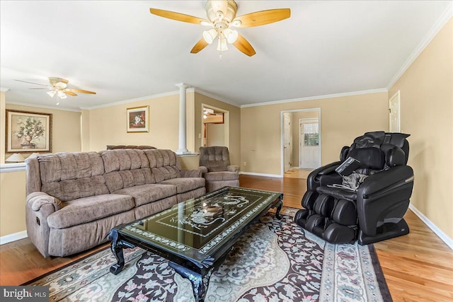 228 Benjamin Blvd, Bear, DE 19701 - living area featuring a ceiling fan, ornate columns, wood finished floors, and ornamental molding