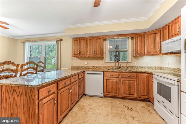228 Benjamin Blvd, Bear, DE 19701 - kitchen featuring white appliances, a ceiling fan, brown cabinetry, crown molding, and a peninsula