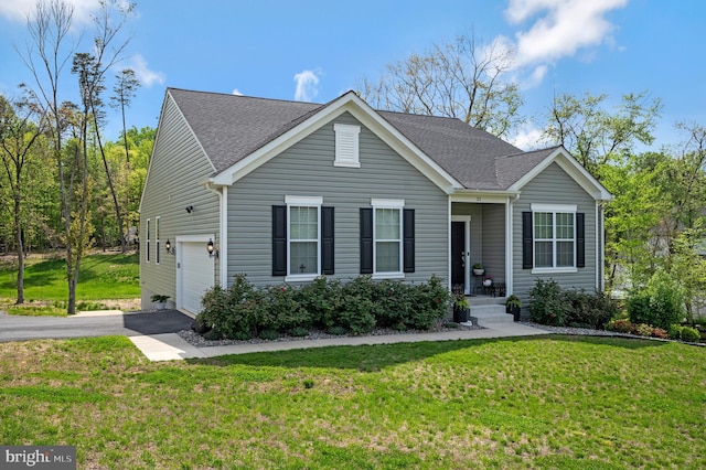 21 Walnut Grove Dr, Fredericksburg, VA 22406 - view of front of house with asphalt driveway, a front lawn, a garage, and a shingled roof