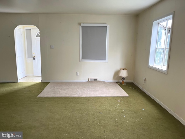 717 Garnet Rd, Wilmington, DE 19804 - carpeted empty room with baseboards and arched walkways