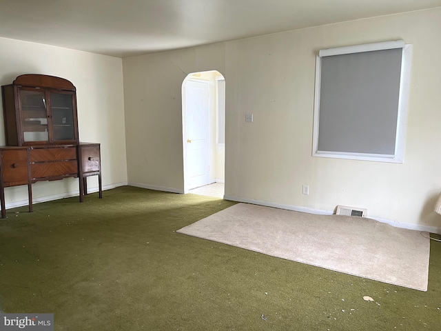 717 Garnet Rd, Wilmington, DE 19804 - spare room featuring carpet flooring and arched walkways