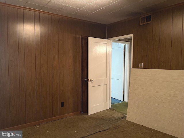 717 Garnet Rd, Wilmington, DE 19804 - unfurnished room with wooden walls and dark carpet