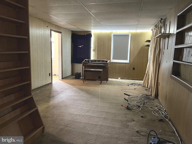 717 Garnet Rd, Wilmington, DE 19804 - basement with wooden walls, carpet, and a drop ceiling