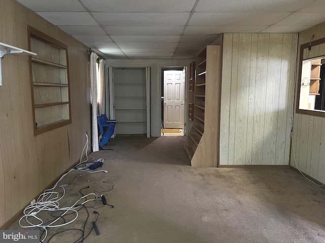 717 Garnet Rd, Wilmington, DE 19804 - carpeted empty room featuring wooden walls and a paneled ceiling