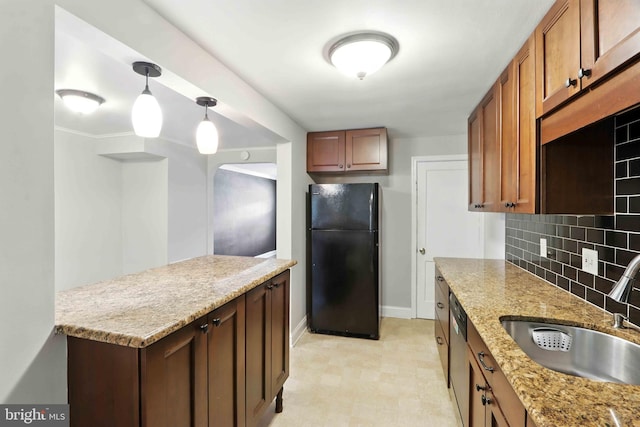 3714 Greenvale Rd, Baltimore, MD 21229 - kitchen with freestanding refrigerator, decorative backsplash, light flooring, dishwasher, and hanging light fixtures