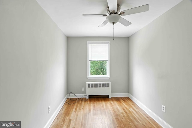 3714 Greenvale Rd, Baltimore, MD 21229 - spare room with radiator, wood finished floors, and ceiling fan