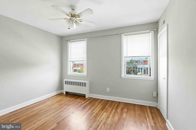 3714 Greenvale Rd, Baltimore, MD 21229 - unfurnished room featuring radiator, wood finished floors, and a ceiling fan
