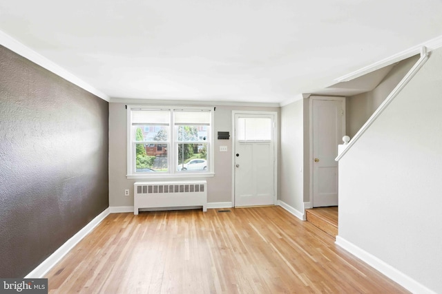 3714 Greenvale Rd, Baltimore, MD 21229 - entrance foyer with radiator heating unit, wood finished floors, and ornamental molding